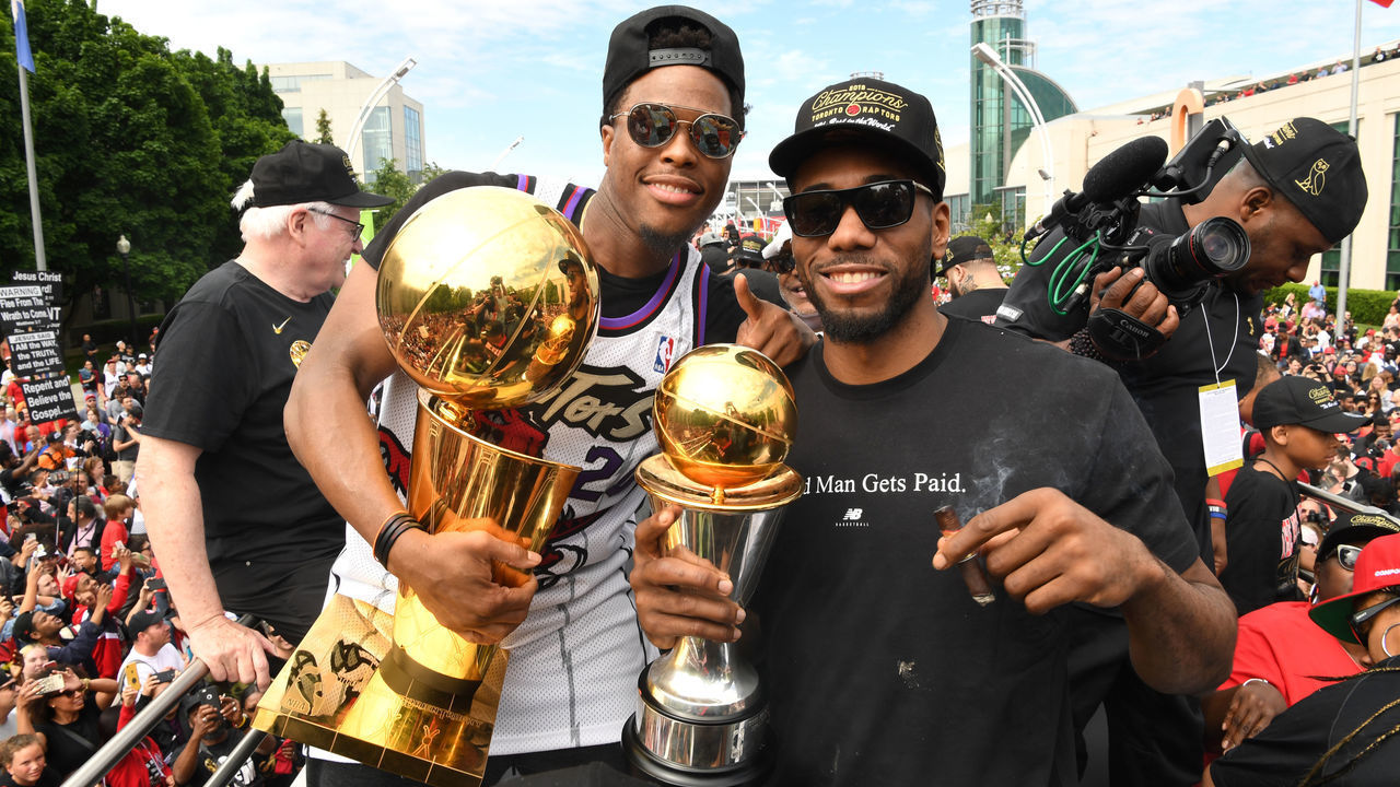 TORONTO, ON - JUNE 17: Kyle Lowry #7 and Kawhi Leonard #2 of the Toronto Raptors are photographed with the Championship Trophies on the team bus during the Toronto Raptors Championship Victory Parade on June 17, 2019 in Toronto, Ontario. NOTE TO USER: User expressly acknowledges and agrees that, by downloading and/or using this photograph, user is consenting to the terms and conditions of Getty Images License Agreement. Mandatory Copyright Notice: Copyright 2019 NBAE