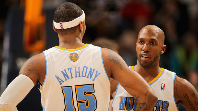 DENVER, CO - JANUARY 21: Carmelo Anthony #15 and Chauncey Billups #1 of the Denver Nuggets talk during a break in the action against the Los Angeles Lakers at the Pepsi Center on January 21, 2011 in Denver, Colorado. The Lakers defeated the Nuggets 107-97.