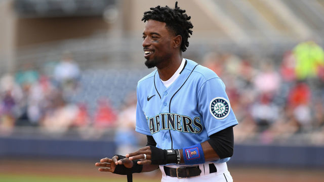 PEORIA, ARIZONA - MARCH 10: Dee Gordon #9 of the Seattle Mariners gestures to a teammate during a spring training game against the Los Angeles Angels at Peoria Stadium on March 10, 2020 in Peoria, Arizona.