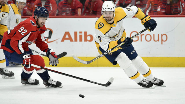 WASHINGTON, DC - JANUARY 29: Predators left wing Filip Forsberg (9) races Capitals center Evgeny Kuznetsov (92) to a loose puck during the Nashville Predators vs. Washington Capitals NHL game on January 29, 2020 at Capital One Arena in Washington, D.C..