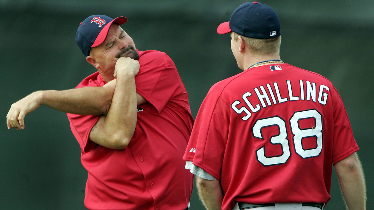 FORT MYERS, FL - MARCH 1: David Wells, left, stretches out while talking with Curt Schilling, right, during the morning workout.