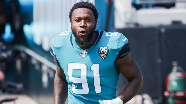 JACKSONVILLE, FLORIDA - OCTOBER 13: Yannick Ngakoue #91 of the Jacksonville Jaguars charges onto the field to face the New Orleans Saints before the start of the first quarter at TIAA Bank Field on October 13, 2019 in Jacksonville, Florida.