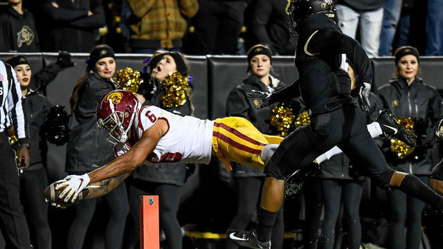 BOULDER, CO - OCTOBER 25: Michael Pittman Jr. #6 of the USC Trojans dives across the goal line for a fourth-quarter go ahead touchdown against the Colorado Buffaloes at Folsom Field on October 25, 2019 in Boulder, Colorado.