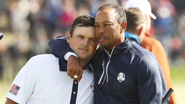 PARIS, FRANCE - SEPTEMBER 29: Tiger Woods of the United States consolls Patrick Reed of the United States following defeat during the morning fourball matches of the 2018 Ryder Cup at Le Golf National on September 29, 2018 in Paris, France.