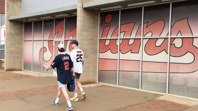 GOODYEAR, AZ - MARCH 12: A couple of Cleveland Indians fans walk to the ticket office to check on the status of getting a refund after Major League Baseball suspends Spring Training at Goodyear Ballpark on March 12, 2020 in Goodyear, Arizona. MLB suspended spring training due to the ongoing threat of the coronavirus (COVID-19) outbreak.
