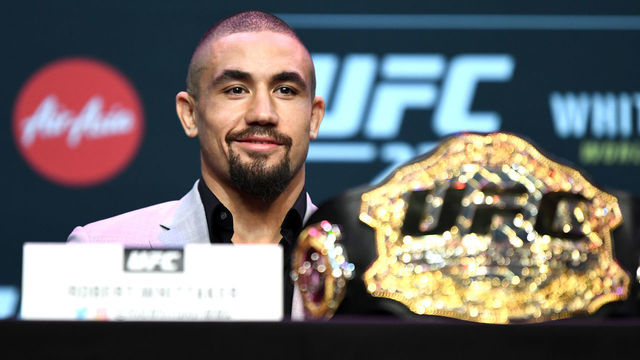 MELBOURNE, AUSTRALIA - FEBRUARY 8: UFC middleweight champion Robert Whittaker of Australia speaks to the media during the UFC 234 Press Conference inside The Palms at Crown on February 8, 2019 in Melbourne, Australia.