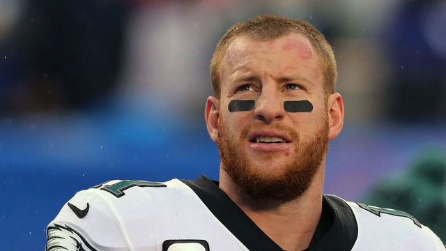 EAST RUTHERFORD, NEW JERSEY - DECEMBER 29: Quarterback Carson Wentz #11 of the Philadelphia Eagles follows the action against the New York Giants in the rain in the first half at MetLife Stadium on December 29, 2019 in East Rutherford, New Jersey.