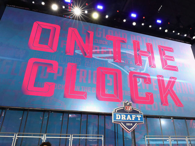 ARLINGTON, TX - APRIL 26: A video board displays the text "ON THE CLOCK" for the New England Patriots during the first round of the 2018 NFL Draft at AT&T Stadium on April 26, 2018 in Arlington, Texas.