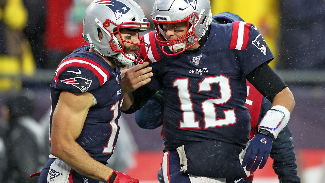 FOXBOROUGH, MA - OCTOBER 27: New England Patriots wide receiver Julian Edelman, left, and quarterback Tom Brady celebrate after an 8-yard first quarter touchdown pass. The New England Patriots host the Cleveland Browns in a regular season NFL football game at Gillette Stadium in Foxborough, MA on Oct. 27, 2019.