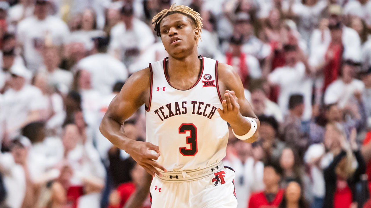 LUBBOCK, TEXAS - MARCH 07: Guard Jahmi'us Ramsey #3 of the Texas Tech Red Raiders signals after making a three-pointer during the first half of the college basketball game against the Kansas Jayhawks on March 07, 2020 at United Supermarkets Arena in Lubbock, Texas.