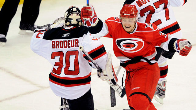 RALEIGH, NC - APRIL 21: Jussi Jokinen #36 of the Carolina Hurricanes celebrates after scoring the game-winning goal against Martin Brodeur #30 of the New Jersey Devils during Game Four of the Eastern Conference Quarterfinals of the 2009 Stanley Cup Playoffs on April 21, 2009 at the RBC Center in Raleigh, North Carolina.