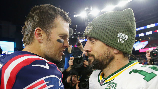 FOXBOROUGH, MA - NOVEMBER 04: Tom Brady #12 of the New England Patriots talks with Aaron Rodgers #12 of the Green Bay Packers after the Patriots defeated the Packers 31-17 at Gillette Stadium on November 4, 2018 in Foxborough, Massachusetts.