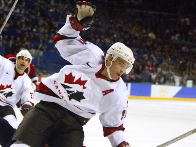 24 Feb 2002: Joe Sakic #91 of Canada celebrates after scoring the team's fifth goal against the USA during the men's ice hockey gold medal game of the Salt Lake City Winter Olympic Games at the E Center in Salt Lake City, Utah. DIGITAL IMAGE. Mandatory Credit: Al Bello/Getty Images
