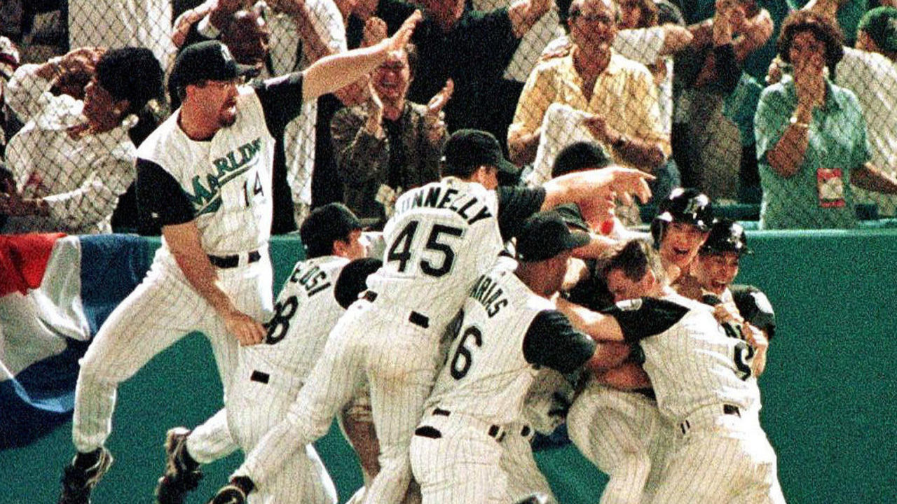 MIAMI, : The Florida Marlins celebrate their 3-2 win over the Cleveland Indians in game seven of the World Series 26 October at Pro Player Stadium. The Marlins defeated the Indians 3-2 in 11 innings. AFP PHOTO/Roberto SCHMIDT