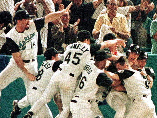 MIAMI, : The Florida Marlins celebrate their 3-2 win over the Cleveland Indians in game seven of the World Series 26 October at Pro Player Stadium. The Marlins defeated the Indians 3-2 in 11 innings. AFP PHOTO/Roberto SCHMIDT