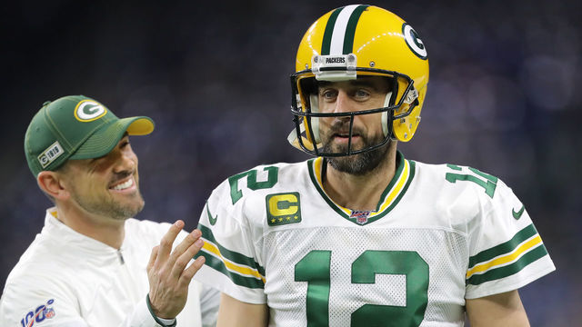 DETROIT, MI - DECEMBER 29: Head coach Matt LaFleur of the Green Bay Packers and Aaron Rodgers #12 of the Green Bay Packers have a conversation during warm ups prior to the start of the game against the Detroit Lions at Ford Field on December 29, 2019 in Detroit, Michigan.