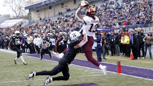 EVANSTON, ILLINOIS - NOVEMBER 23: Rashod Bateman #13 of the Minnesota Golden Gophers makes a catch for a touchdown in front of Travis Whillock #7 of the Northwestern Wildcats during the first quarter at Ryan Field on November 23, 2019 in Evanston, Illinois.
