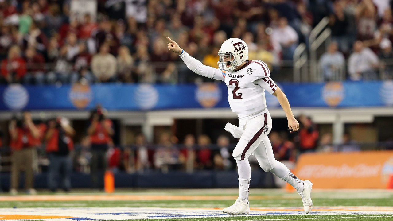 ARLINGTON, TX - JANUARY 04: Johnny Manziel #2 of the Texas A&M Aggies celebrates a touchdown against the Oklahoma Sooners during the Cotton Bowl at Cowboys Stadium on January 4, 2013 in Arlington, Texas.