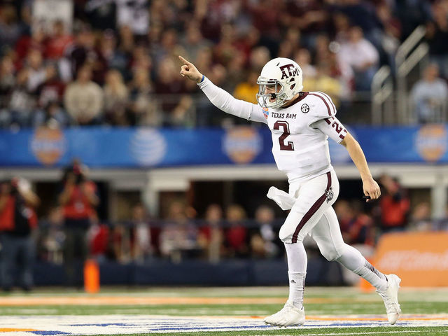 ARLINGTON, TX - JANUARY 04: Johnny Manziel #2 of the Texas A&M Aggies celebrates a touchdown against the Oklahoma Sooners during the Cotton Bowl at Cowboys Stadium on January 4, 2013 in Arlington, Texas.