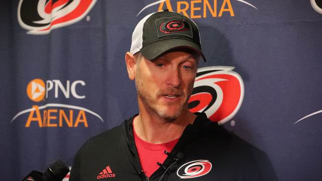 RALEIGH, NC - FEBRUARY 19: Carolina Hurricanes owner Tom Dundon gets interviewed before the warmups of the Carolina Hurricanes game versus the New York Rangers on February 19th, 2019 at PNC Arena in Raleigh, NC.