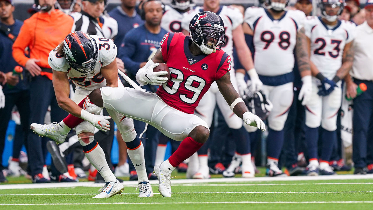 HOUSTON, TX - DECEMBER 08: Denver Broncos running back Phillip Lindsay (30) tackles Houston Texans free safety Tashaun Gipson (39) after Gipson's interception return during the NFL game between the Denver Broncos and Houston Texans on December 8, 2019 at NRG Stadium in Houston, TX.