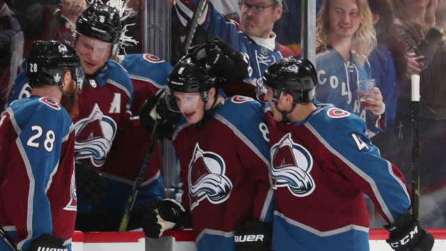 DENVER, CO - APRIL 15: Cale Makar #8 of the Colorado Avalanche celebrates with teammates Ian Cole #28, Erik Johnson #6 and Tyson Barrie #4 after scoring a goal against the Calgary Flames in Game Three of the Western Conference First Round during the 2019 NHL Stanley Cup Playoffs at the Pepsi Center on April 15, 2019 in Denver, Colorado.