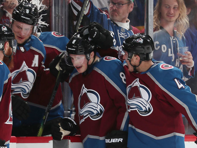 DENVER, CO - APRIL 15: Cale Makar #8 of the Colorado Avalanche celebrates with teammates Ian Cole #28, Erik Johnson #6 and Tyson Barrie #4 after scoring a goal against the Calgary Flames in Game Three of the Western Conference First Round during the 2019 NHL Stanley Cup Playoffs at the Pepsi Center on April 15, 2019 in Denver, Colorado.
