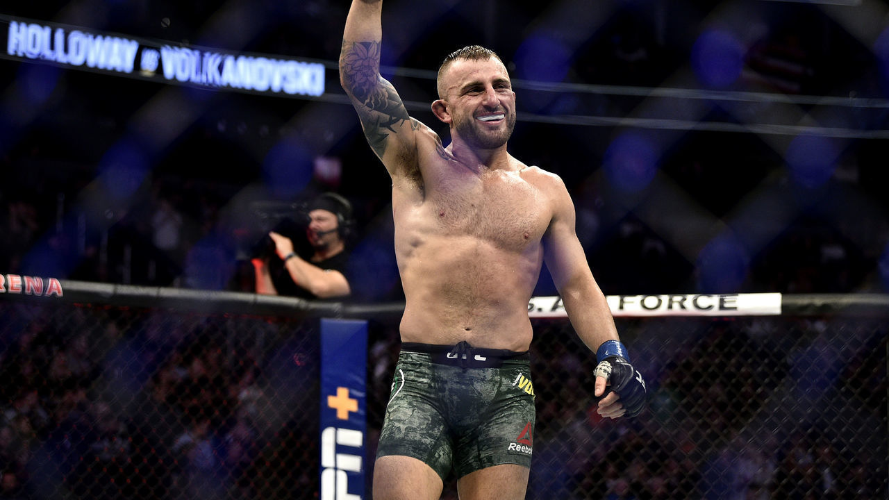 LAS VEGAS, NEVADA - DECEMBER 14: Alexander Volkanovski of Australia celebrates in the octagon at the end of the match during the UFC 245 event at T-Mobile Arena on December 14, 2019 in Las Vegas, Nevada.