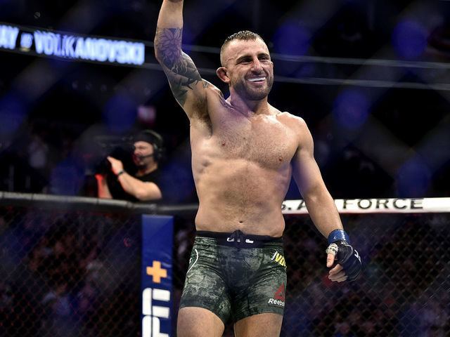 LAS VEGAS, NEVADA - DECEMBER 14: Alexander Volkanovski of Australia celebrates in the octagon at the end of the match during the UFC 245 event at T-Mobile Arena on December 14, 2019 in Las Vegas, Nevada.