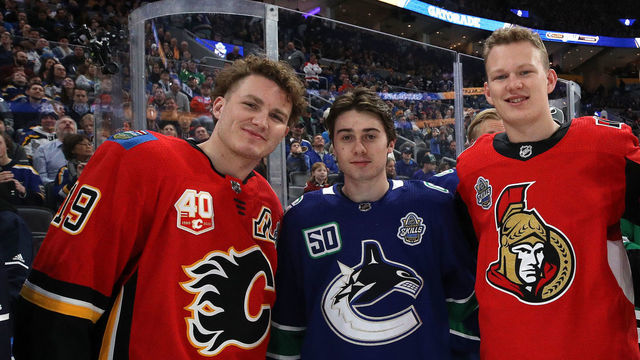 ST LOUIS, MISSOURI - JANUARY 24: (L-R) Matthew Tkachuk #19 of the Calgary Flames, Quinn Hughes #43 of the Vancouver Canucks, Brady Tkachuk #7 of the Ottawa Senators and Mark Giordano #5 of the Calgary Flames pose during the Bud Light NHL Save Streak during the 2020 NHL All-Star Skills Competition at Enterprise Center on January 24, 2020 in St Louis, Missouri.