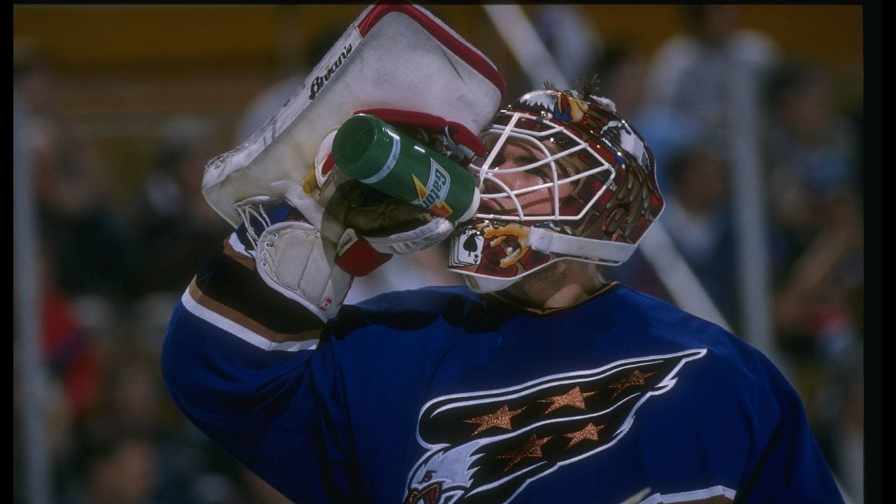 3 Apr 1996: Goaltender Jim Carey of the Washington Capitals takes a drink during a game against the Buffalo Sabres at Memorial Auditorium in Buffalo, New York. Mandatory Credit: Rick Stewart /Allsport