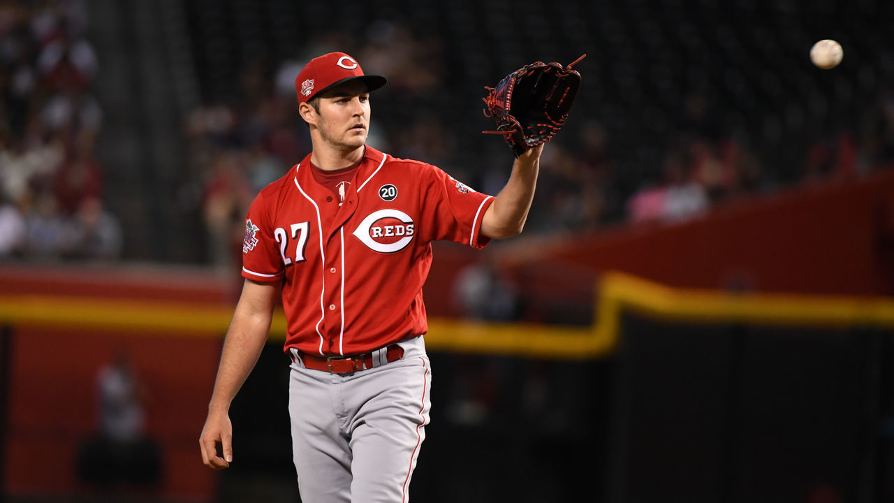 PHOENIX, ARIZONA - SEPTEMBER 15: Trevor Bauer #27 of the Cincinnati Reds catches a throw back from home plate during a game against the Arizona Diamondbacks at Chase Field on September 15, 2019 in Phoenix, Arizona.