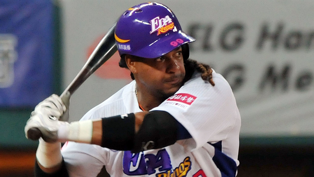 This photo taken on March 27, 2013 shows former Boston Red Sox slugger Manny Ramirez poised to swing during his debut game on the island after joining EDA Rhinos in March, in Taiwan's southern Kaohsiung baseball stadium. US baseball legend Manny Ramirez quit Taiwan's EDA Rhinos on June 19, breaking local fans' hearts just three-months after joining the team despite being the highest paid player in the league's history. AFP PHOTO / Mandy Cheng