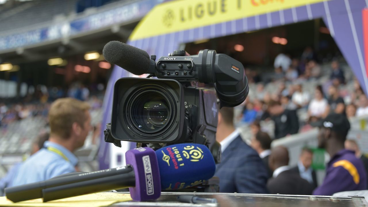 A microphone of Bein Sports TV channel and a camera are pictured during the French L1 football match between Toulouse and Nimes on August 25, 2018 at the Municipal Stadium in Toulouse, southern France.