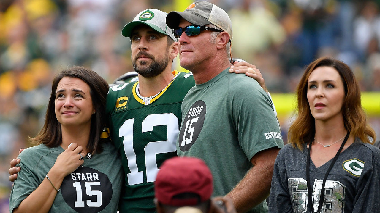 GREEN BAY, WISCONSIN - SEPTEMBER 15: Aaron Rodgers #12 of the Green Bay Packers shares a moment with former quarterback Brett Favre during a ceremony for the late Bart Starr at halftime of the game between the Minnesota Vikings and Green Bay Packers at Lambeau Field on September 15, 2019 in Green Bay, Wisconsin.