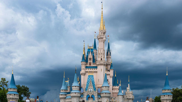 ORLANDO, FLORIDA, UNITED STATES - 2019/07/17: The Cinderella Castle during an overcast day is seen in the Walt Disney's Magic Kingdom theme park. The park is a famous place and tourist attraction.