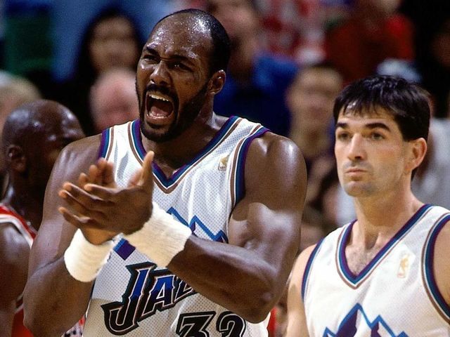 SALT LAKE CITY, UT - JUNE: Karl Malone #32 and John Stockton #12 of the Utah Jazz display emotion against the Chicago Bulls during the 1997 NBA Finals at the Delta Center in Salt Lake City, Utah. NOTE TO USER: User expressly acknowledges that, by downloading and or using this photograph, User is consenting to the terms and conditions of the Getty Images License agreement. Mandatory Copyright Notice: Copyright 1997 NBAE
