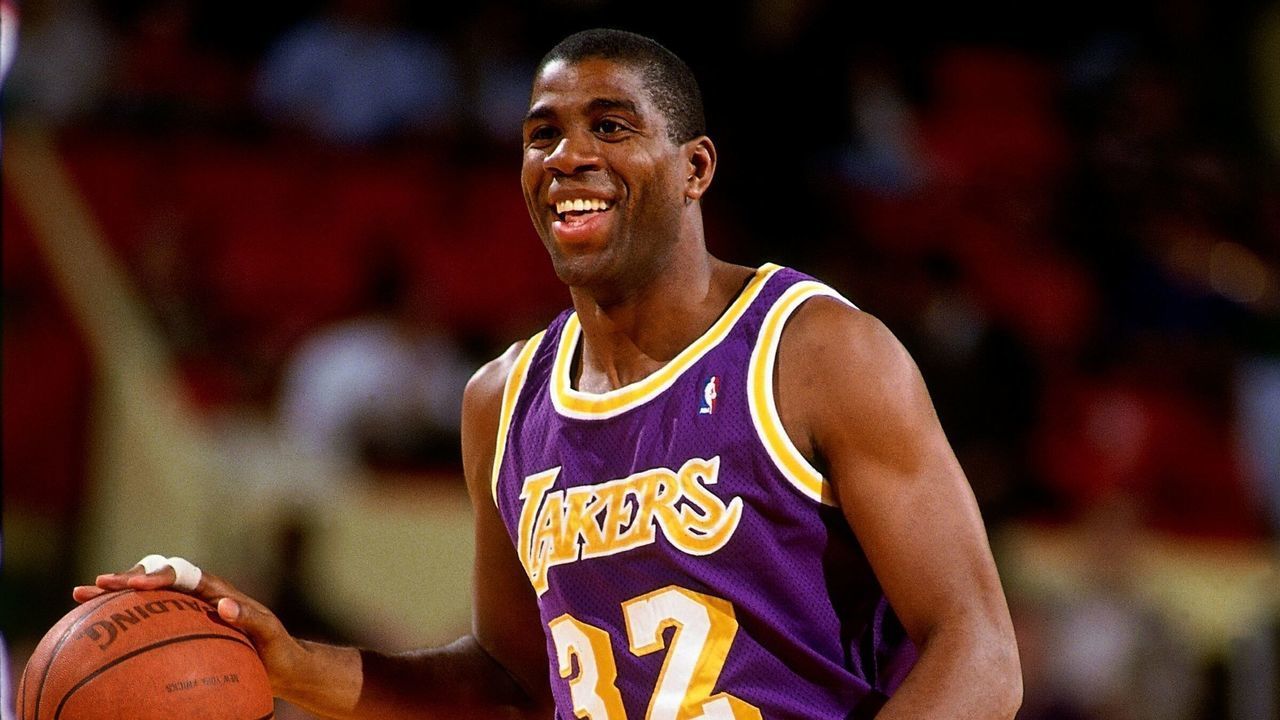 NEW YORK - 1990: Magic Johnson #32 of the Los Angeles Lakers moves the ball up court during a game against the New York Knicks circa 1990 at Madison Square Garden in New York, New York. NOTE TO USER: User expressly acknowledges that, by downloading and or using this photograph, User is consenting to the terms and conditions of the Getty Images License agreement. Mandatory Copyright Notice: Copyright 1990 NBAE