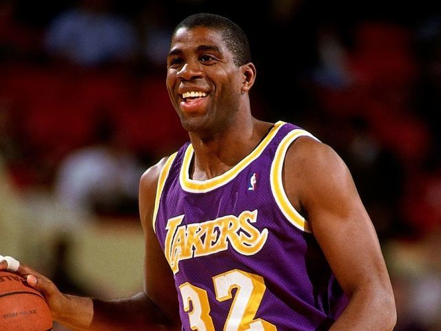 NEW YORK - 1990: Magic Johnson #32 of the Los Angeles Lakers moves the ball up court during a game against the New York Knicks circa 1990 at Madison Square Garden in New York, New York. NOTE TO USER: User expressly acknowledges that, by downloading and or using this photograph, User is consenting to the terms and conditions of the Getty Images License agreement. Mandatory Copyright Notice: Copyright 1990 NBAE