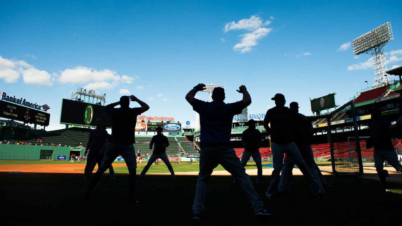 BOSTON, MA - JUNE 11: Members of the Texas Rangers warm up during batting practice prior to the start of the game against the Boston Red Sox at Fenway Park on June 11, 2019 in Boston, Massachusetts.