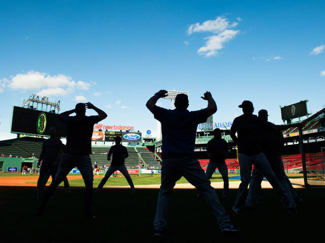 BOSTON, MA - JUNE 11: Members of the Texas Rangers warm up during batting practice prior to the start of the game against the Boston Red Sox at Fenway Park on June 11, 2019 in Boston, Massachusetts.