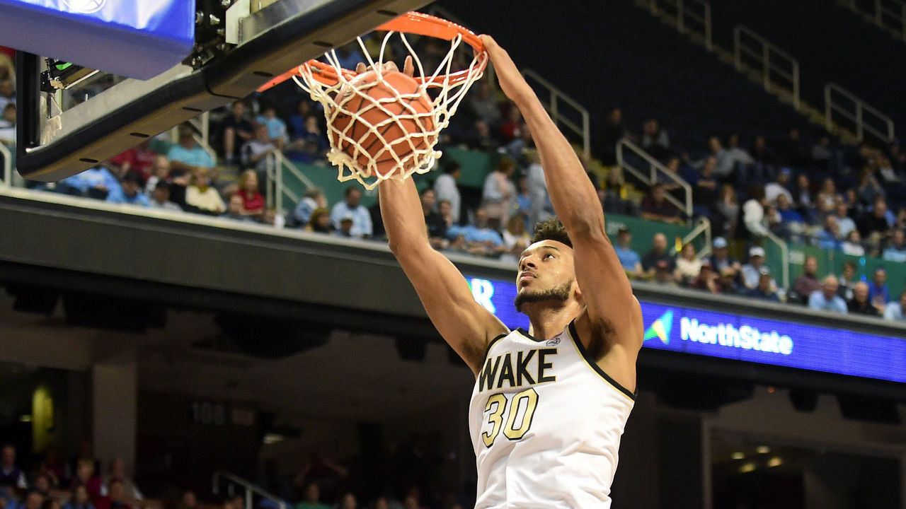 GREENSBORO, NORTH CAROLINA - MARCH 10: Olivier Sarr #30 of the Wake Forest Demon Deacons dunks the ball against the Pittsburgh Panthers during their game in the first round of the 2020 Men's ACC Basketball Tournament at Greensboro Coliseum on March 10, 2020 in Greensboro, North Carolina.
