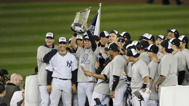 NEW YORK - NOVEMBER 4: Derek Jeter #2 of the New York Yankees holds the Commissioner's Trophy after the Yankees defeated the Philadelphia Phillies in Game Six of the 2009 World Series November 4, 2009 at Yankee Stadium in the Bronx borough of New York City. The Yankees won the series 4-2.