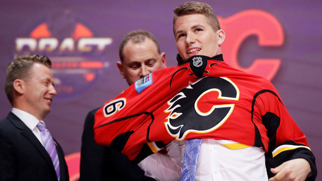 BUFFALO, NY - JUNE 24: Matthew Tkachuk celebrates with the Calgary Flames after being selected sixth overall during round one of the 2016 NHL Draft on June 24, 2016 in Buffalo, New York.