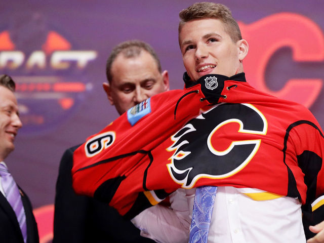 BUFFALO, NY - JUNE 24: Matthew Tkachuk celebrates with the Calgary Flames after being selected sixth overall during round one of the 2016 NHL Draft on June 24, 2016 in Buffalo, New York.