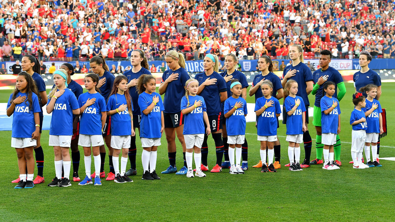 FRISCO, TEXAS - MARCH 11: The United States women's national team stand during the national anthem with their tops turned inside out as part of the team's equal pay campaign before the SheBelieves Cup match against Japan at Toyota Stadium on March 11, 2020 in Frisco, Texas. The United States topped Japan, 3-1.