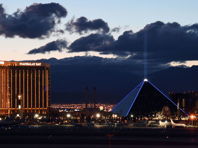 LAS VEGAS, NEVADA - MARCH 15: Mandalay Bay Resort and Casino (L) and Luxor Hotel and Casino are shown as the coronavirus continues to spread across the United States on March 15, 2020 in Las Vegas, Nevada. MGM Resorts International, which operates both properties, announced on Sunday that it will suspend casino operations on Monday and hotel operations on Tuesday at all of its Las Vegas properties until further notice to combat the spread of the virus. The World Health Organization declared the coronavirus (COVID-19) a global pandemic on March 11th.