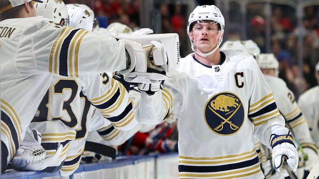 BUFFALO, NY - JANUARY 30: Jack Eichel #9 of the Buffalo Sabres gets fist bumps from the bench after scoring the game's opening goal during the first period of play at the KeyBank Center on January 30, 2020 in Buffalo, New York.