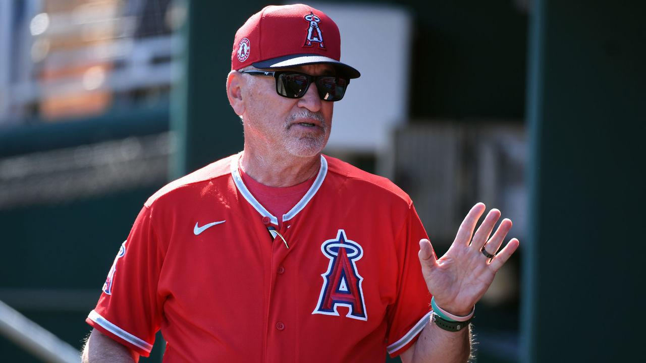 GOODYEAR, ARIZONA - MARCH 03: Manager Joe Maddon #70 of the Los Angeles Angels talks with his players in the dugout prior to a spring training game against the Cleveland Indians at Goodyear Ballpark on March 03, 2020 in Goodyear, Arizona.