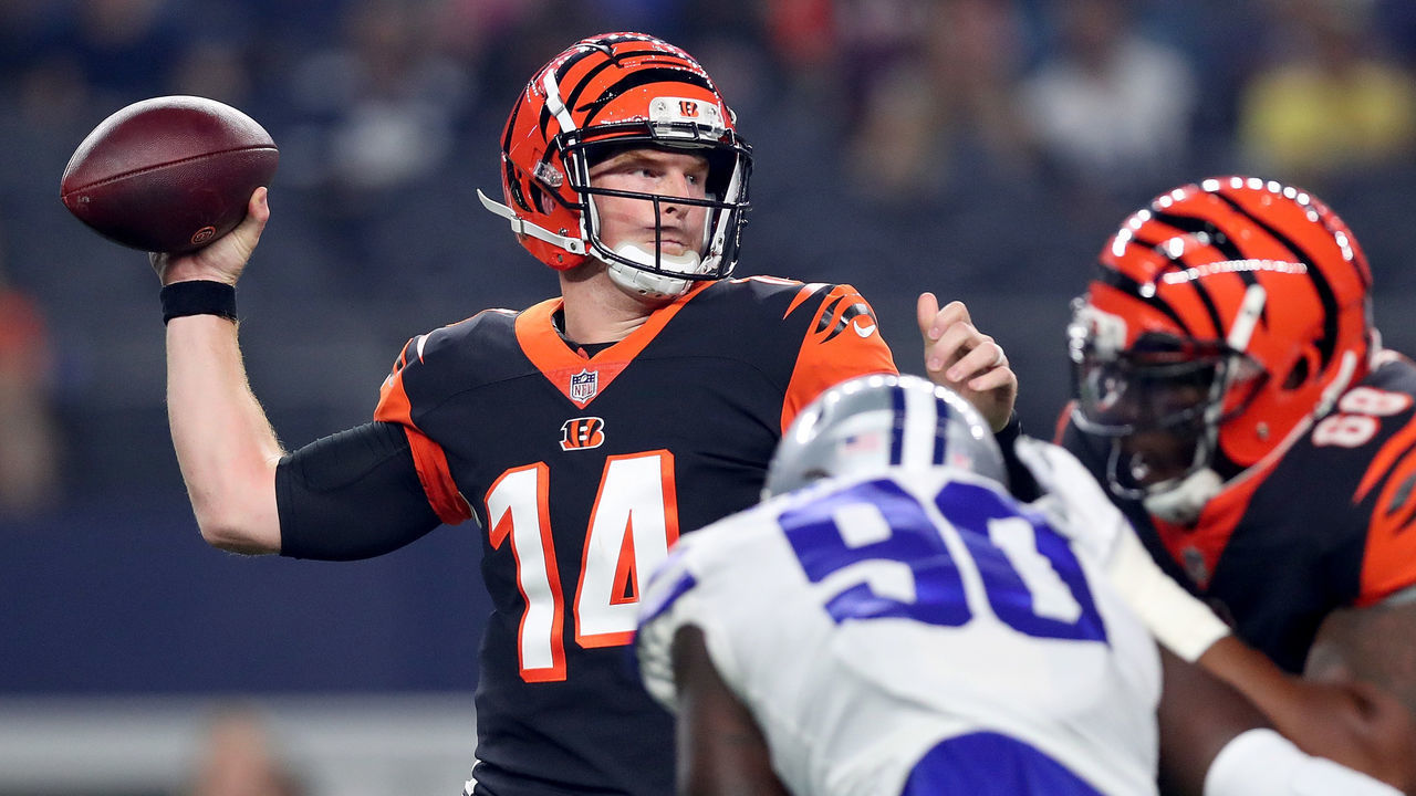 ARLINGTON, TX - AUGUST 18: Andy Dalton #14 of the Cincinnati Bengals looks for an open receiver against the Dallas Cowboys in the first quarter at AT&T Stadium on August 18, 2018 in Arlington, Texas.